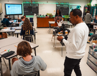  filmmaker takes footage of student in classroom